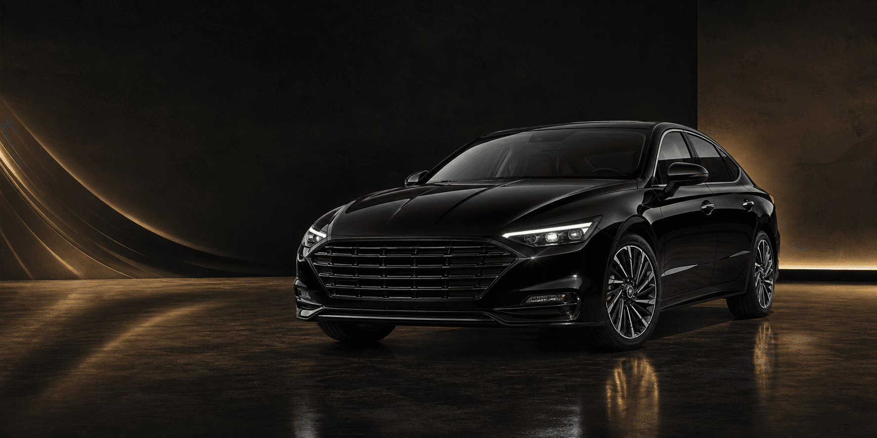Black premium rental car in a dark studio